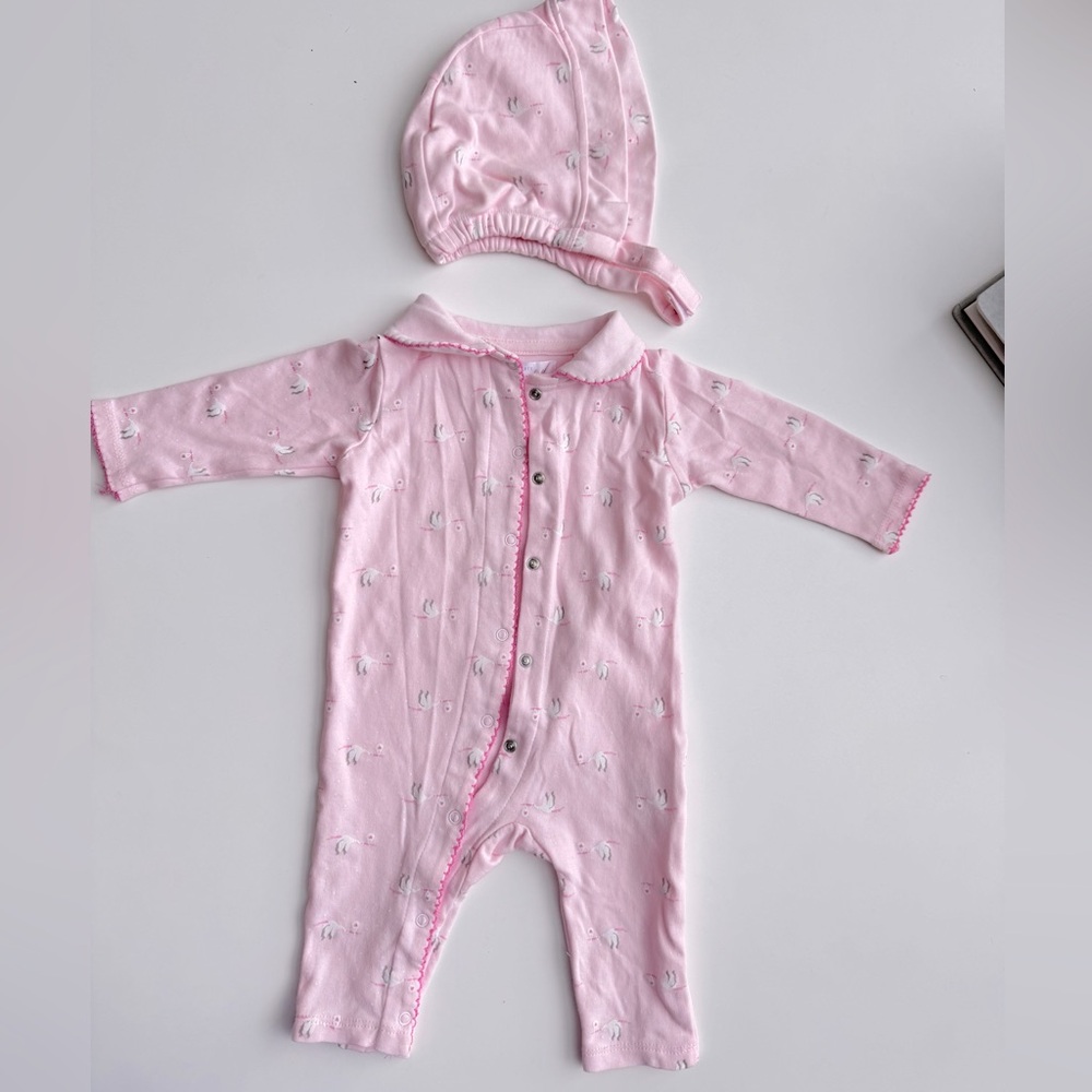 Tres Beau et Belle crane delivering g baby pink onesie suit with hat